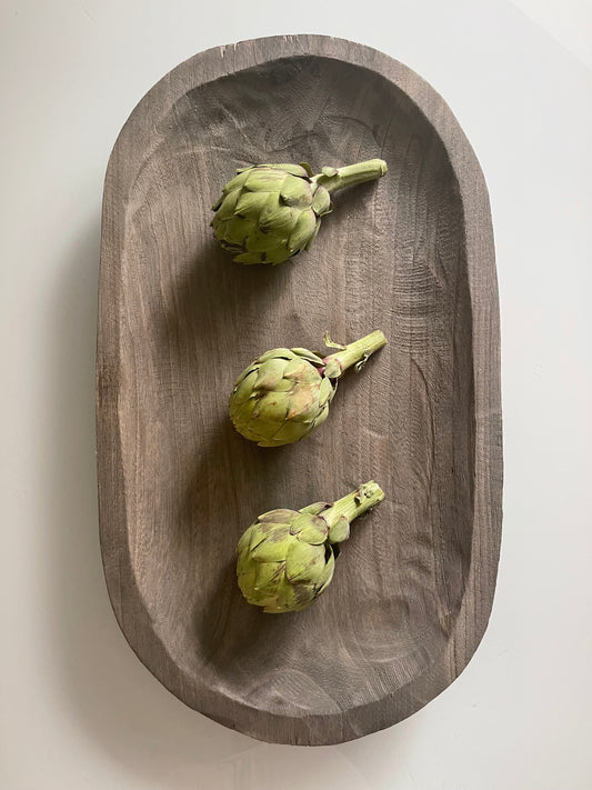 This serving tray is made of durable Paulownia wood and can be used for food, candles, and centerpieces Eco-friendly Grey finish Lightweight for everyday use Hand carved by skilled artisans Dimensions: 13" W x 18" H x 3" D